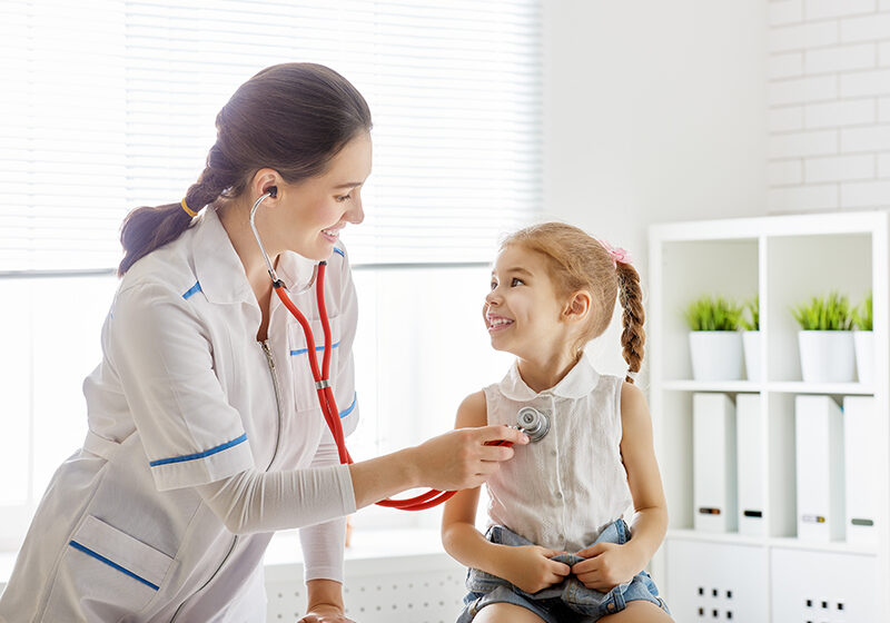 doctor examining a child doctor examining a child girl in a hospital